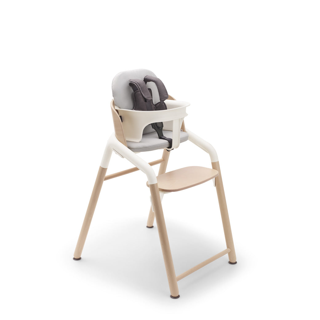 Bugaboo Giraffe High Chair with harness, pillow and baby set  in --Color_Neutral Wood / White