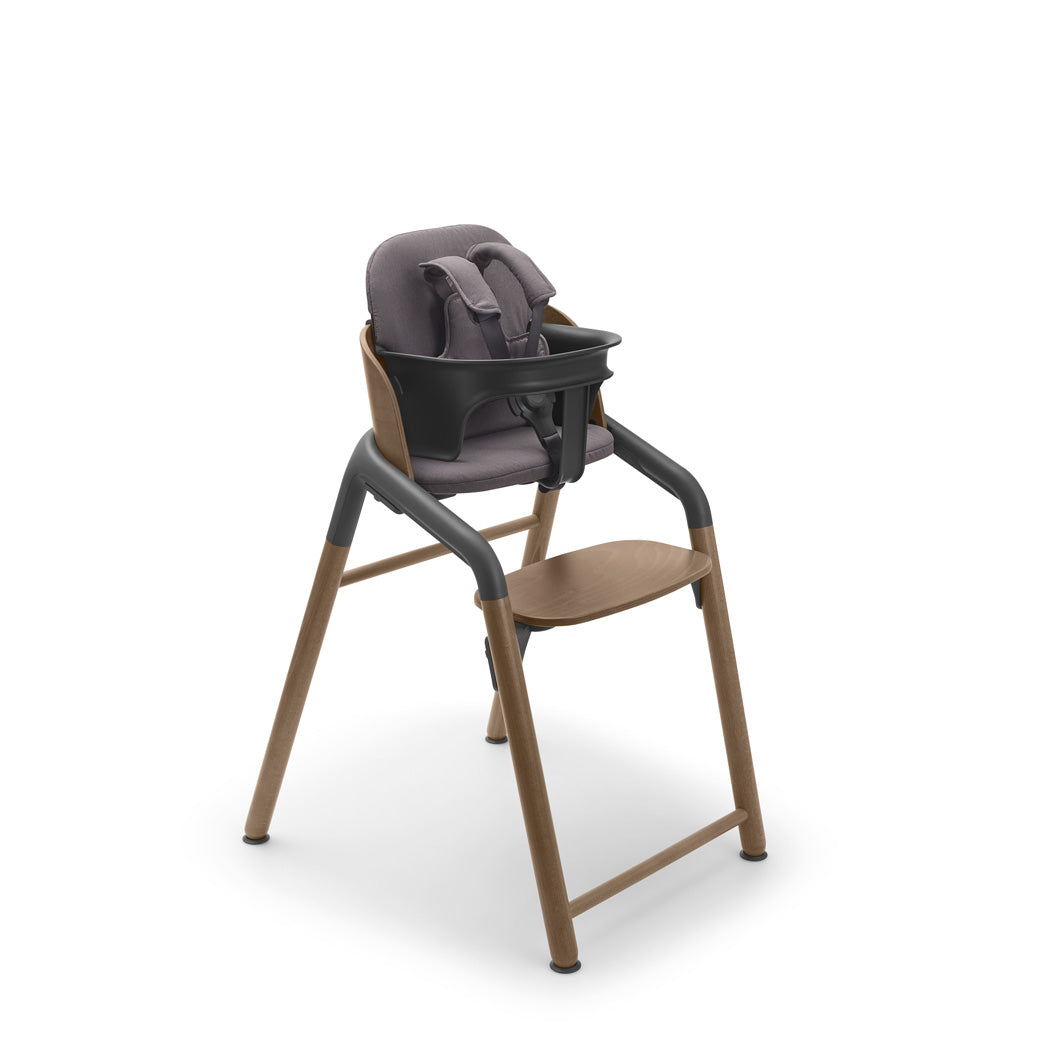 Bugaboo Giraffe High Chair with harness, pillow and baby set in --Color_Warm Wood / Grey