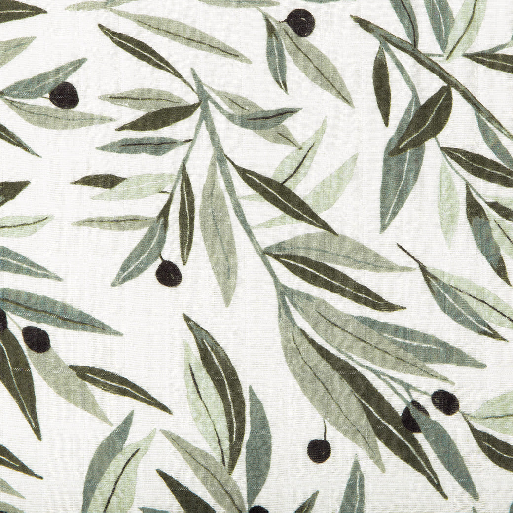 Closeup view of the Babyletto All-Stages Bassinet Sheet In GOTS Certified Organic Muslin Cotton in -- Color_Olive Branches