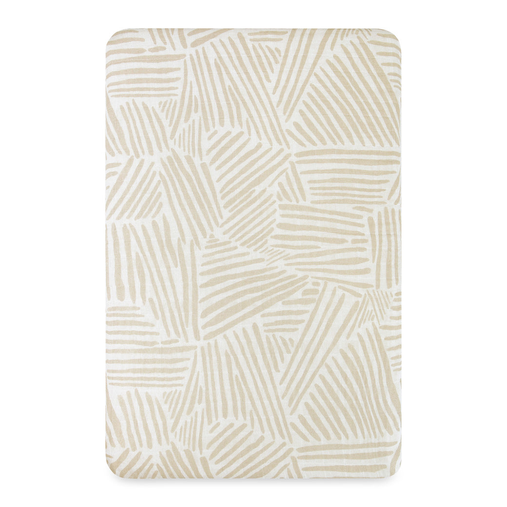 Front view of the Babyletto All-Stages Bassinet Sheet In GOTS Certified Organic Muslin Cotton in -- Color_Oat Stripe