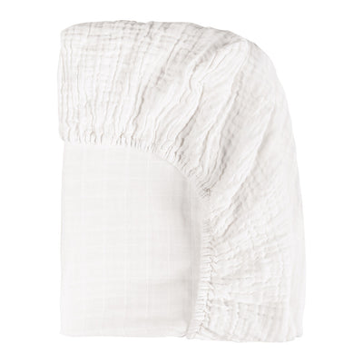 Back side corner view of the Babyletto  All-Stages Bassinet Sheet In GOTS Certified Organic Muslin Cotton in -- Color_White
