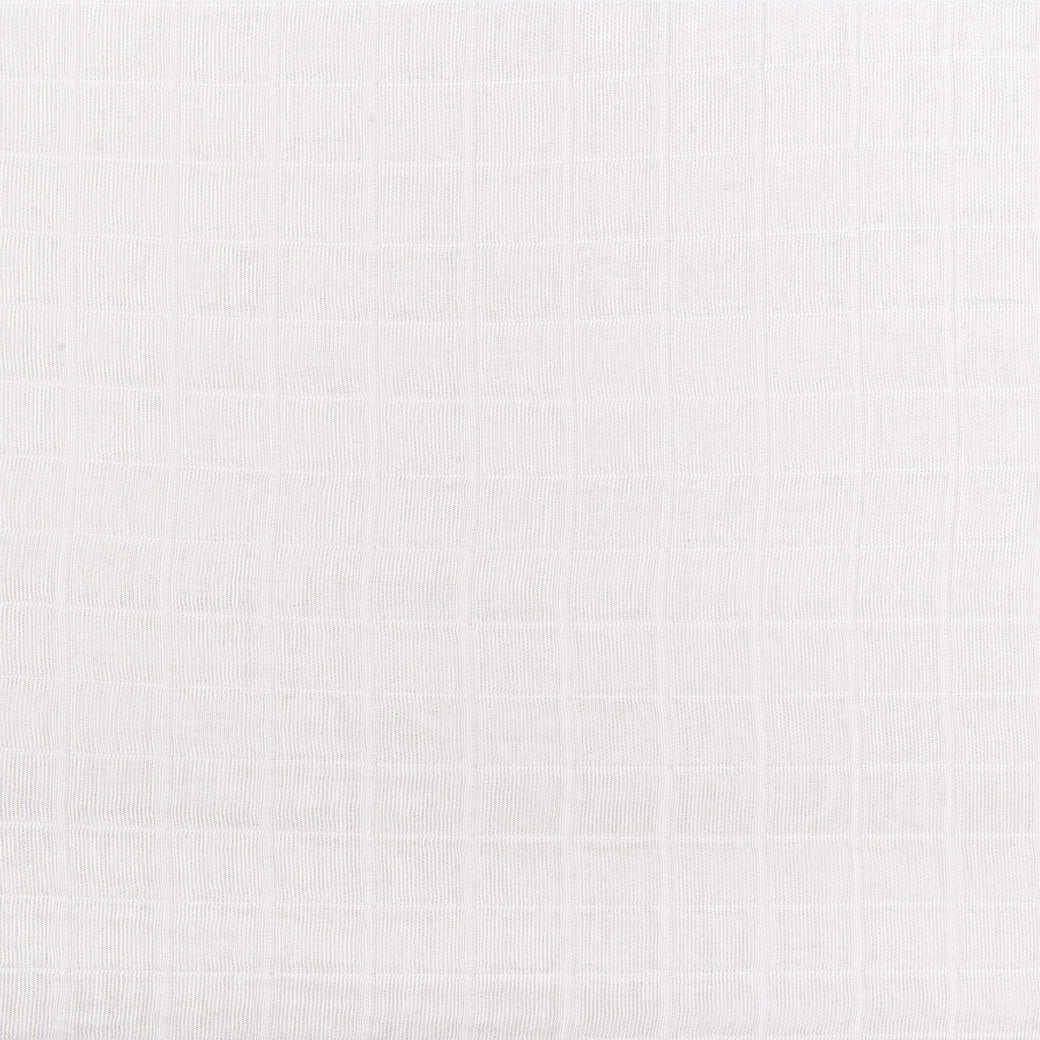 Closeup of the pattern of the Babyletto's Crib Sheet in GOTS Certified Organic Muslin Cotton in -- Color_White