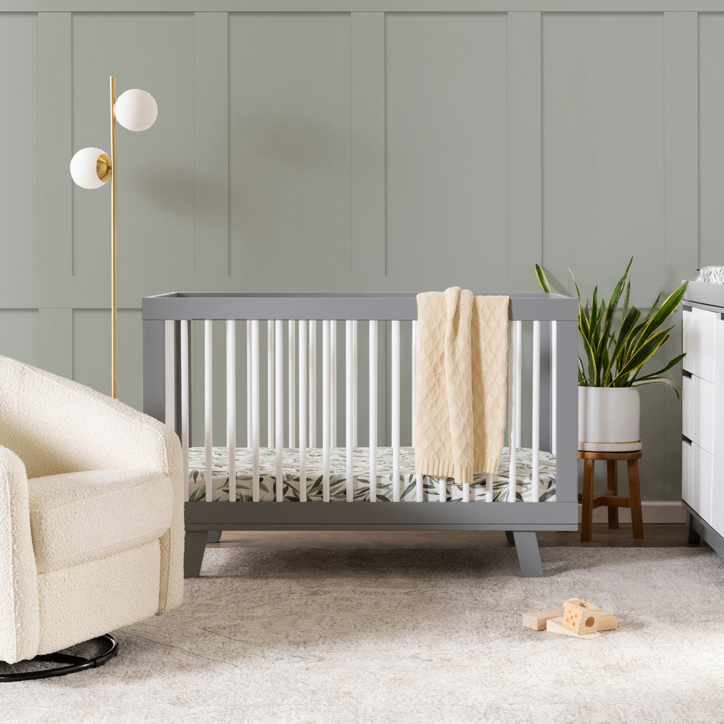 Babyletto Hudson 3-in-1 Convertible Crib And Toddler Rail  with sage wall and sheets in nursery -- Color_White/Grey