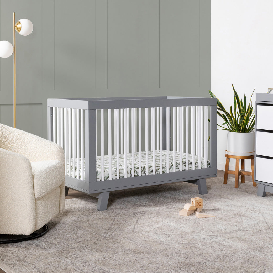 Babyletto Hudson 3-in-1 Convertible Crib And Toddler Rail  in nursery setting -- Color_White/Grey