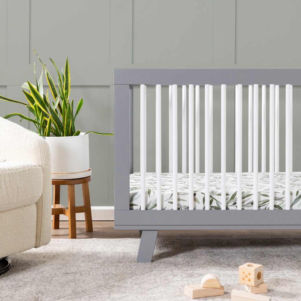 Closeup of Babyletto Hudson 3-in-1 Convertible Crib And Toddler Rail  in nursery -- Color_White/Grey