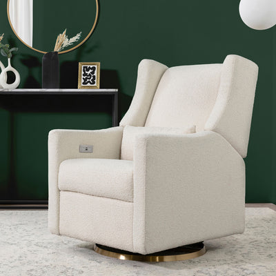 Babyletto Kiwi Glider Recliner in a dark green room in -- Color_Ivory Boucle with Gold Base