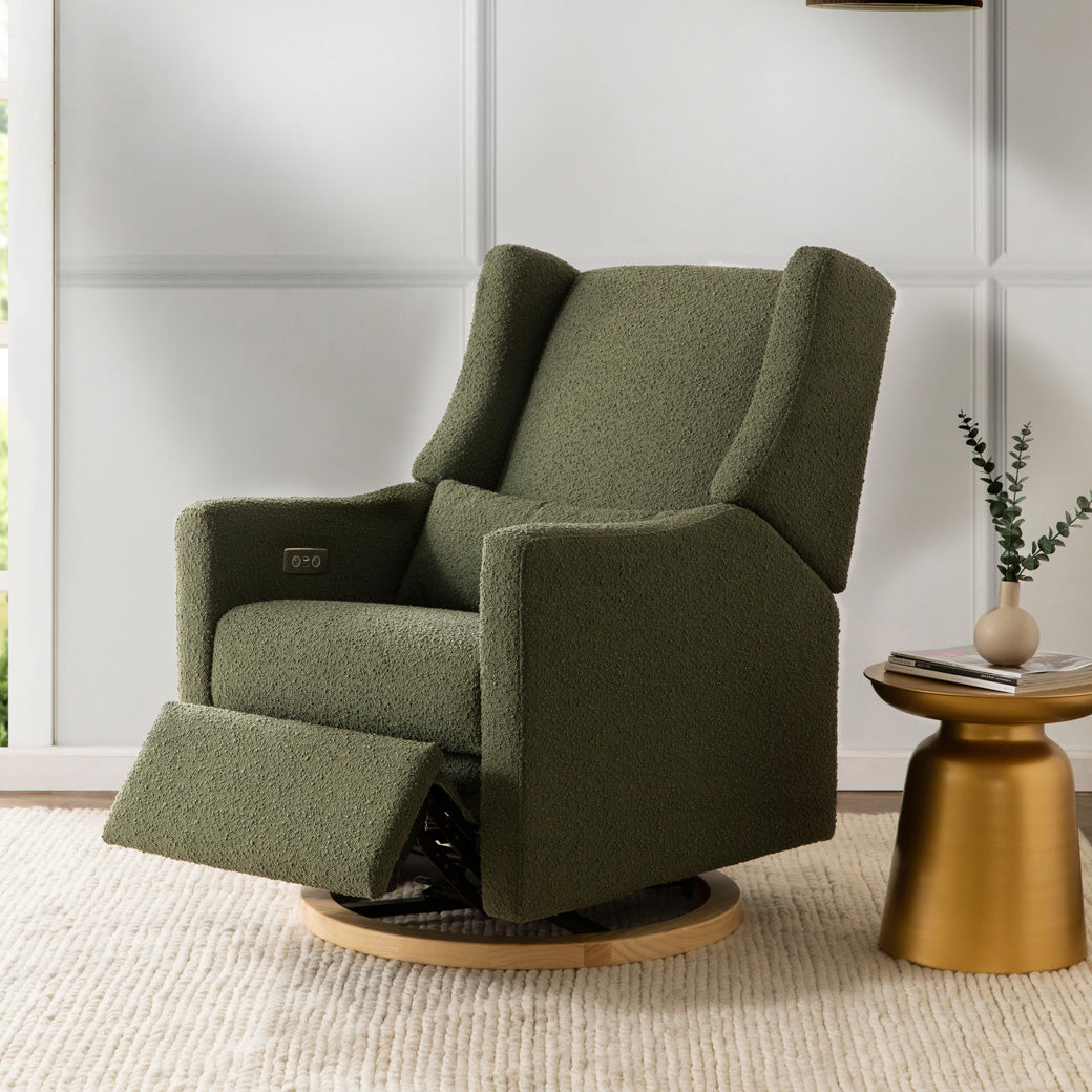 Babyletto Kiwi Glider Recliner next to a table in -- Color_Olive Boucle With Light Base