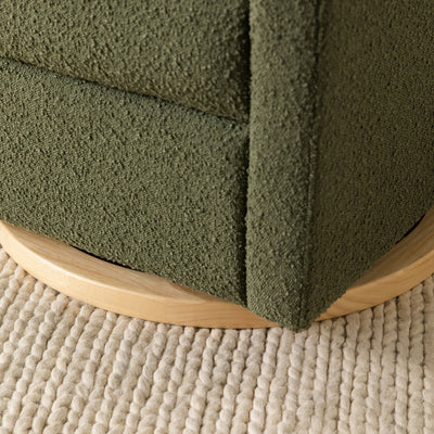Closeup of the base of the Babyletto Kiwi Glider Recliner in -- Color_Olive Boucle With Light Base