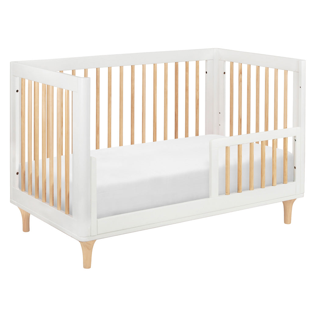 The Babyletto Lolly 3-in-1 Convertible Crib converted into a toddler bed in -- Color_White
