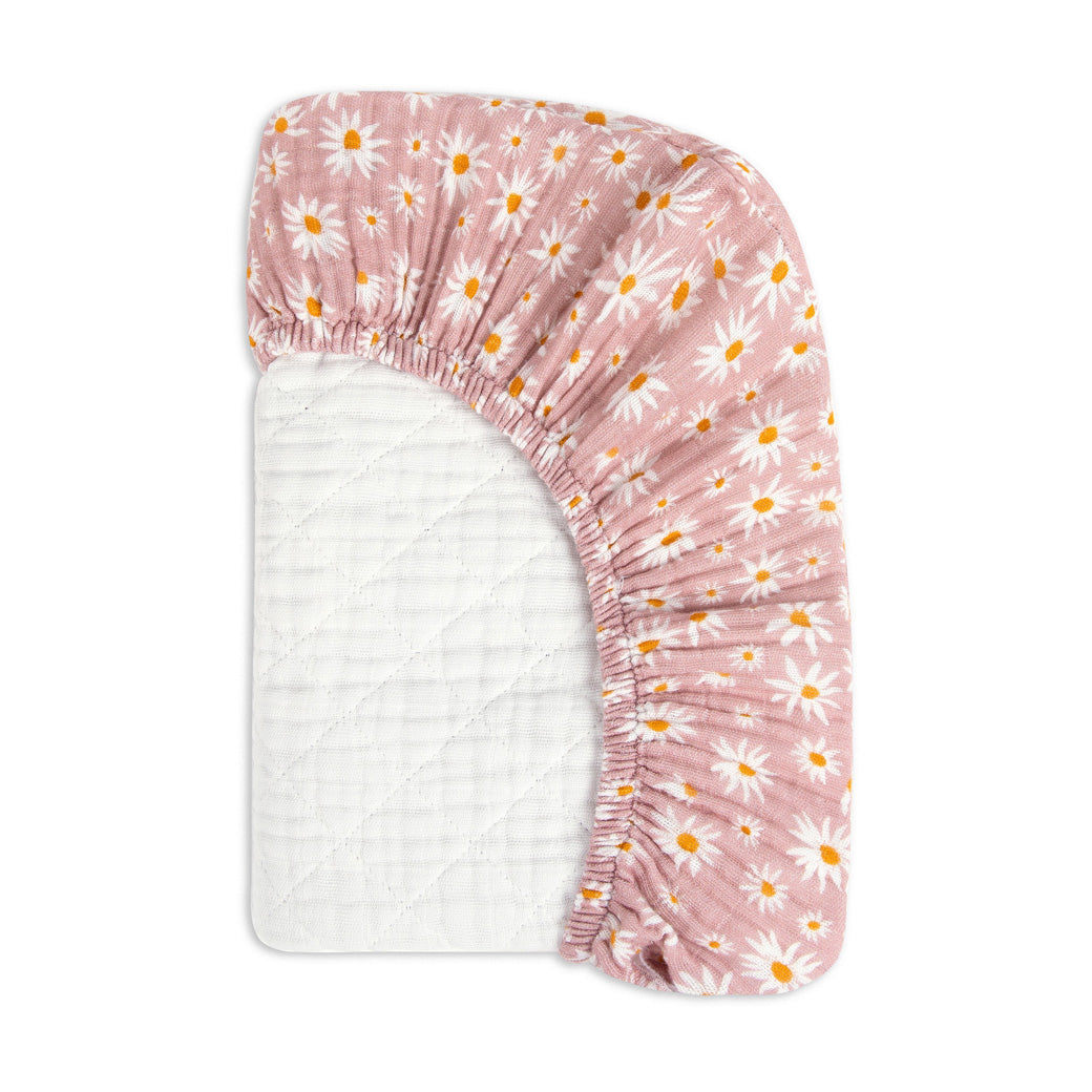Folded corner of the Babyletto Quilted Changing Pad Cover In GOTS Certified Organic Muslin Cotton in -- Color_Daisy
