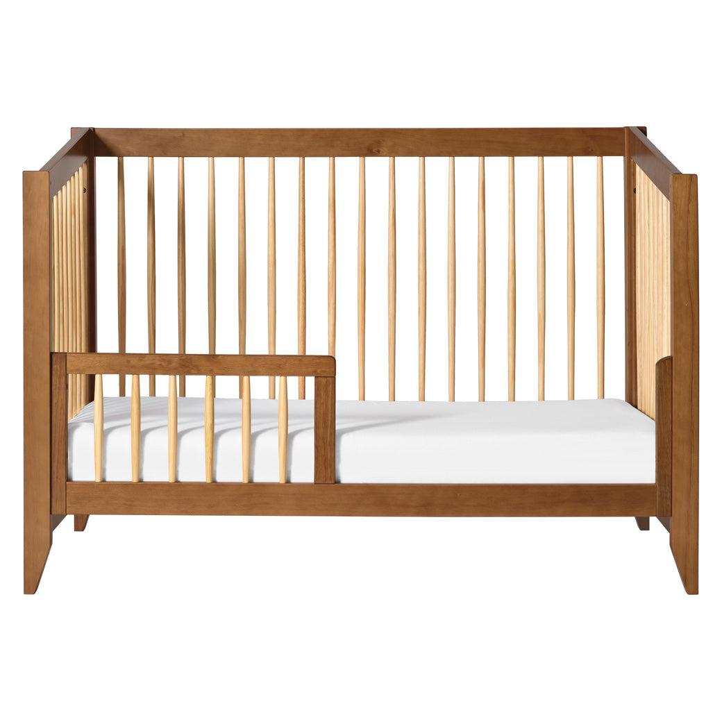 Front view of Babyletto's Sprout 4-in-1 Convertible Crib as toddler bed in -- Color_Chestnut / Natural