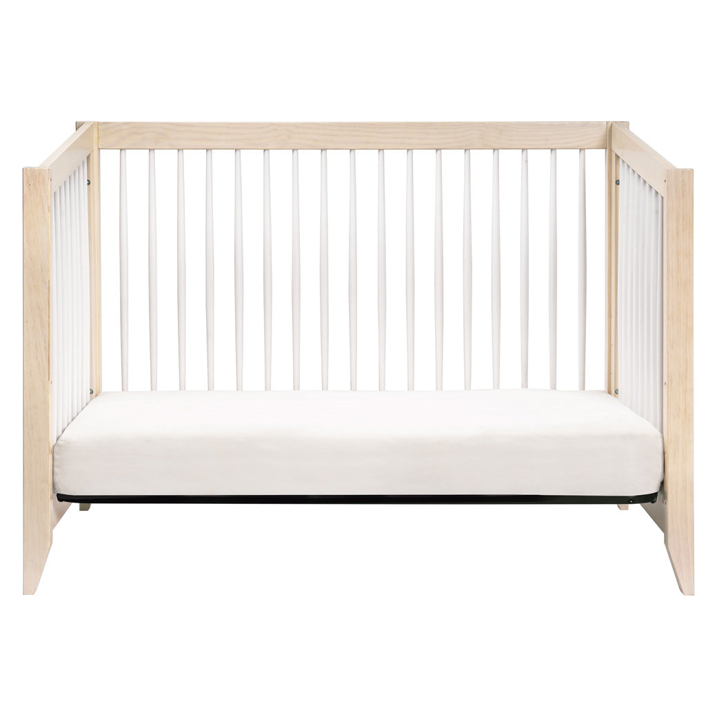 Front view of Babyletto's Sprout 4-in-1 Convertible Crib as daybed in -- Color_Washed Natural / White