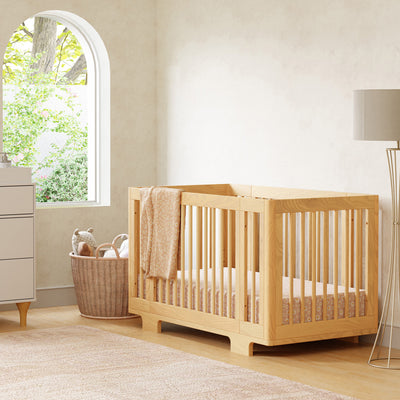 Babyletto's Yuzu 8-In-1 Convertible Crib next to a basket  in -- Color_Natural