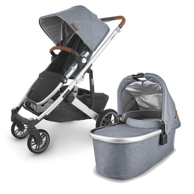 The all-new UPPAbaby CRUZ V2 in black accommpanied by its matching bassinet -- Color_Gregory