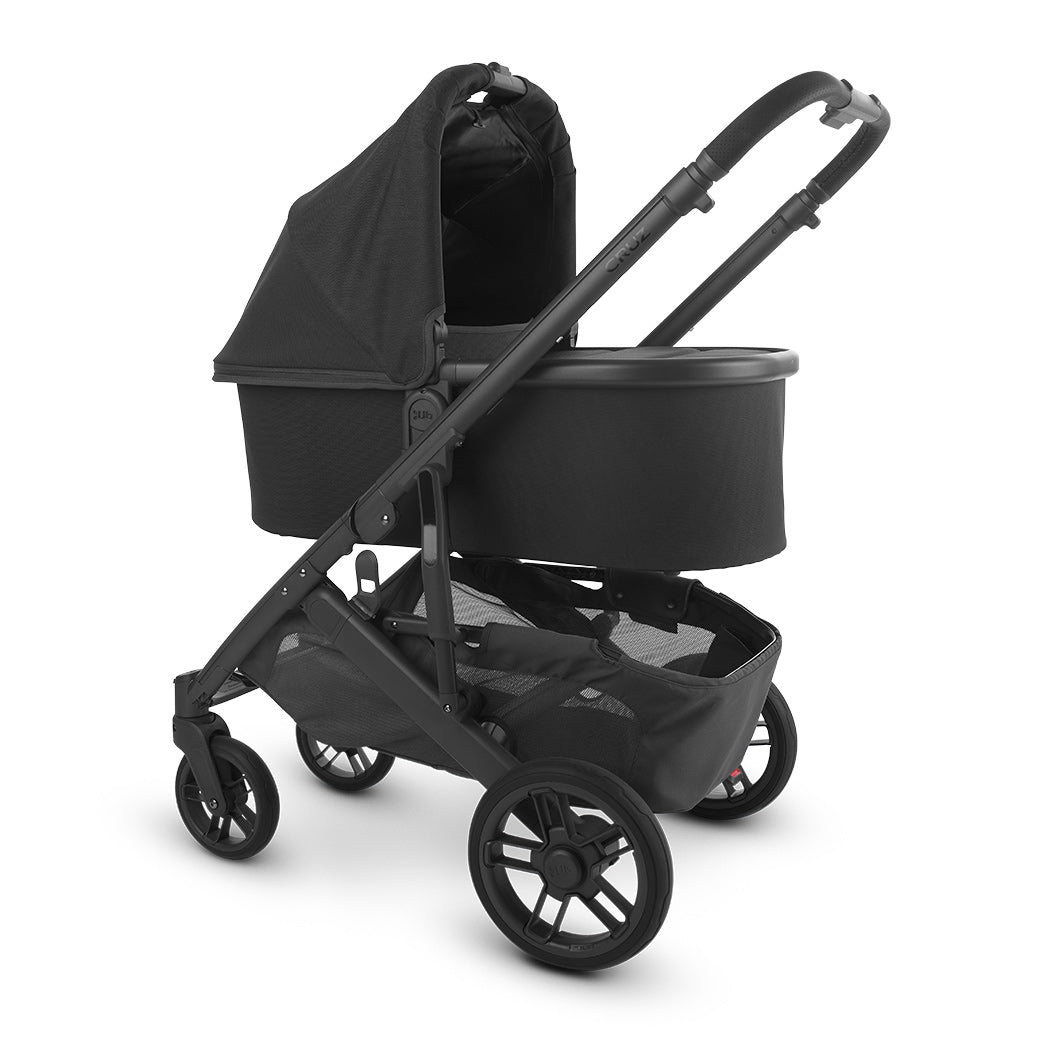 The half extended sunshade on the left side view of uppababy CRUZ V2 bassinet -- Color_Jake