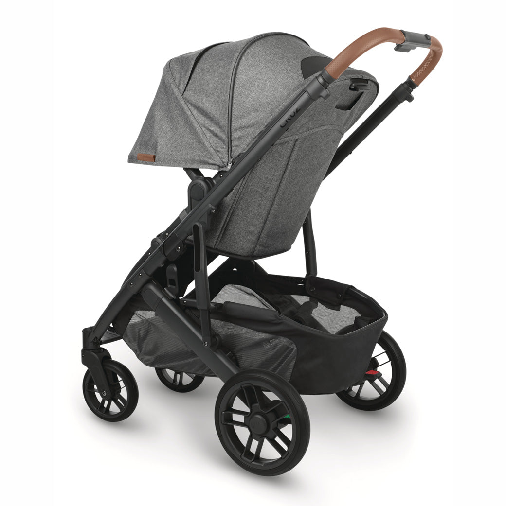 Rear-facing and slightly left angle view of the UPPAbaby CRUZ V2 Stroller with black frame and heather grey fabric -- Color_Greyson