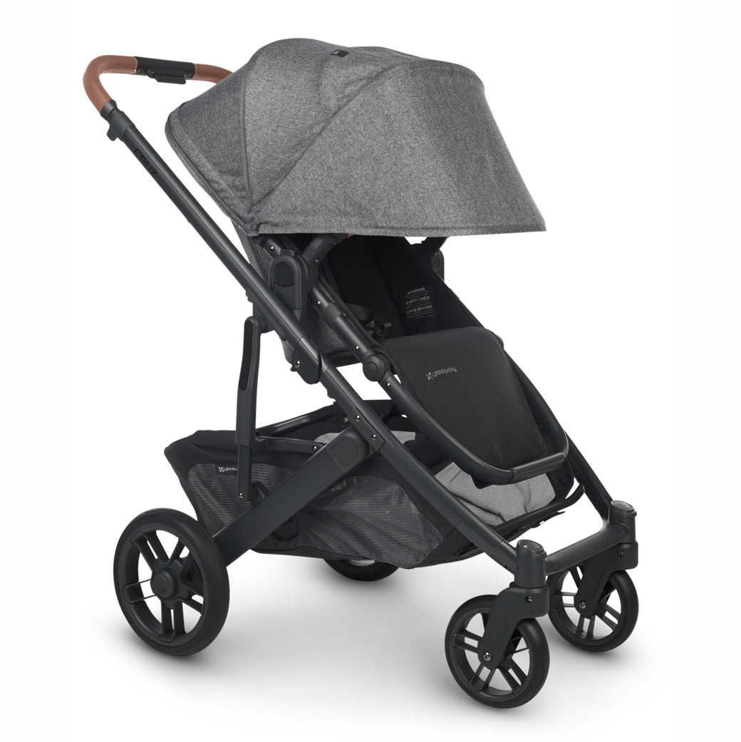 UPPAbaby CRUZ V2 Stroller with black frame and heather grey fabric, angled slightly to the right with sun shade fully extended -- Color_Greyson