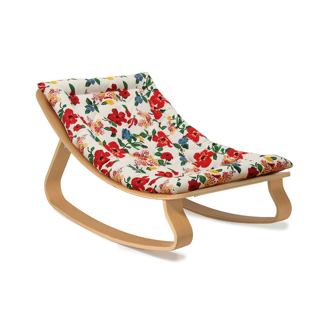Side View of Charlie Crane LEVO Baby Rocker without harness in -- Color_Lucas Du Tertre Hibiscus _ Beech