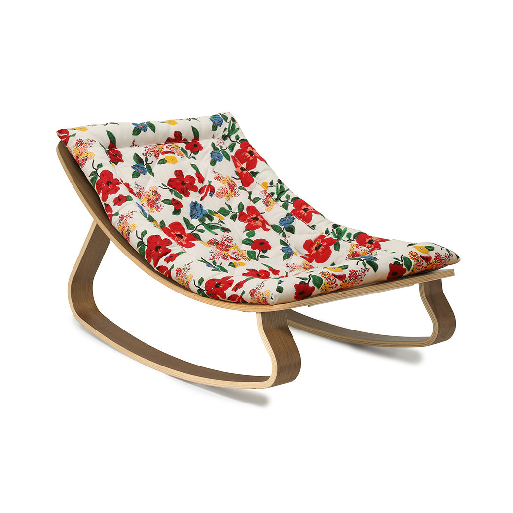 Side view of Charlie Crane LEVO Baby Rocker without harness in -- Color_Lucas Du Tertre Hibiscus _ Walnut