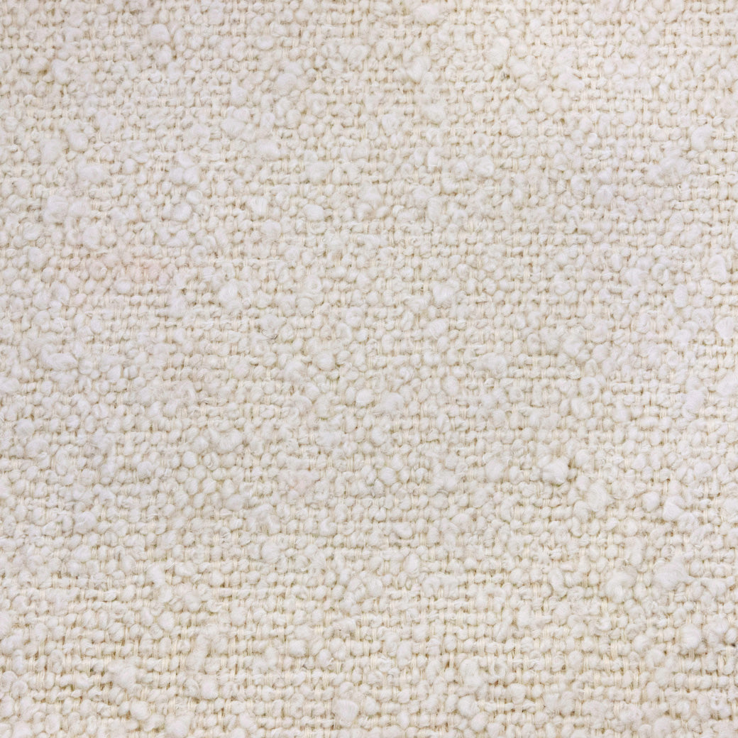 Closeup view of material of Namesake's Crewe Recliner & Swivel Glider in -- Color_Ivory Boucle With Light Wood Base