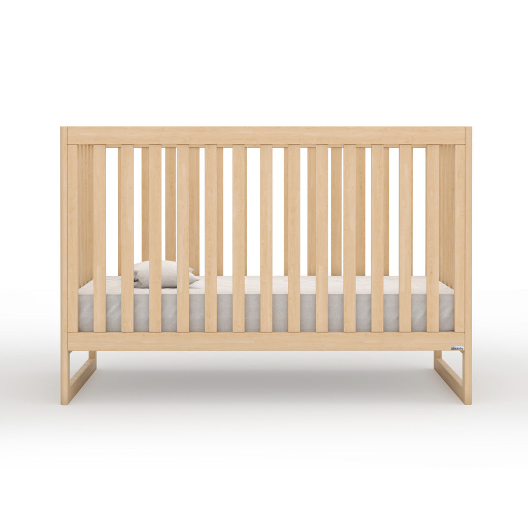 Front view of Dadada Austin 3-in-1 Crib with mattress on the bottom  in -- Color_Natural