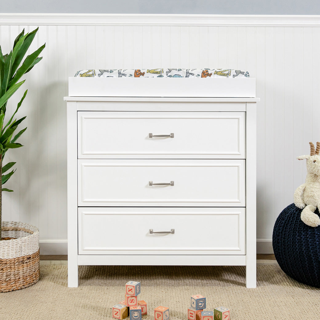 Front view lifestyle photo of The DaVinci Charlie 3-Drawer Dresser with changing tray in -- Color_White