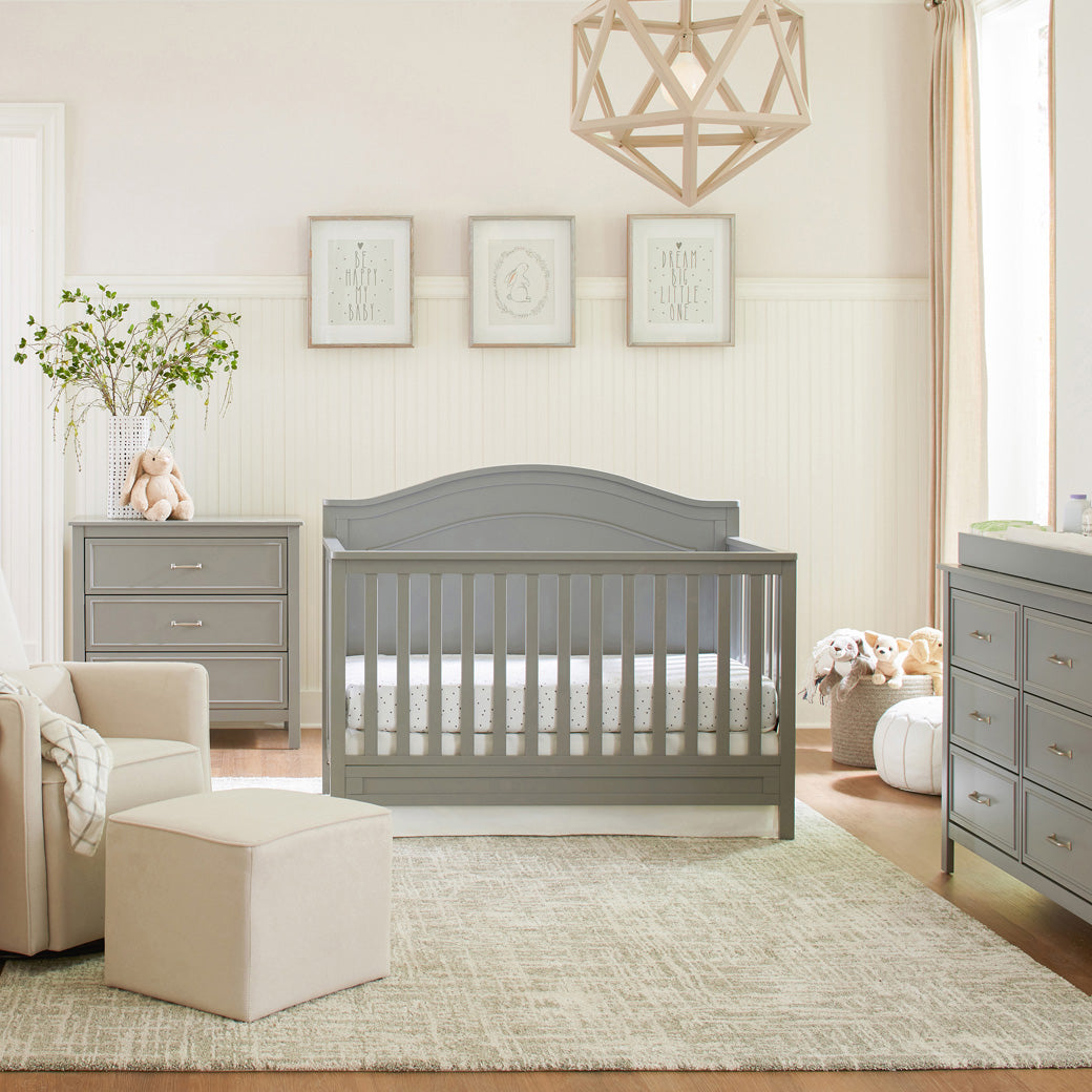 The DaVinci Charlie 4-in-1 Convertible Crib  next to a dresser in -- Color_Grey