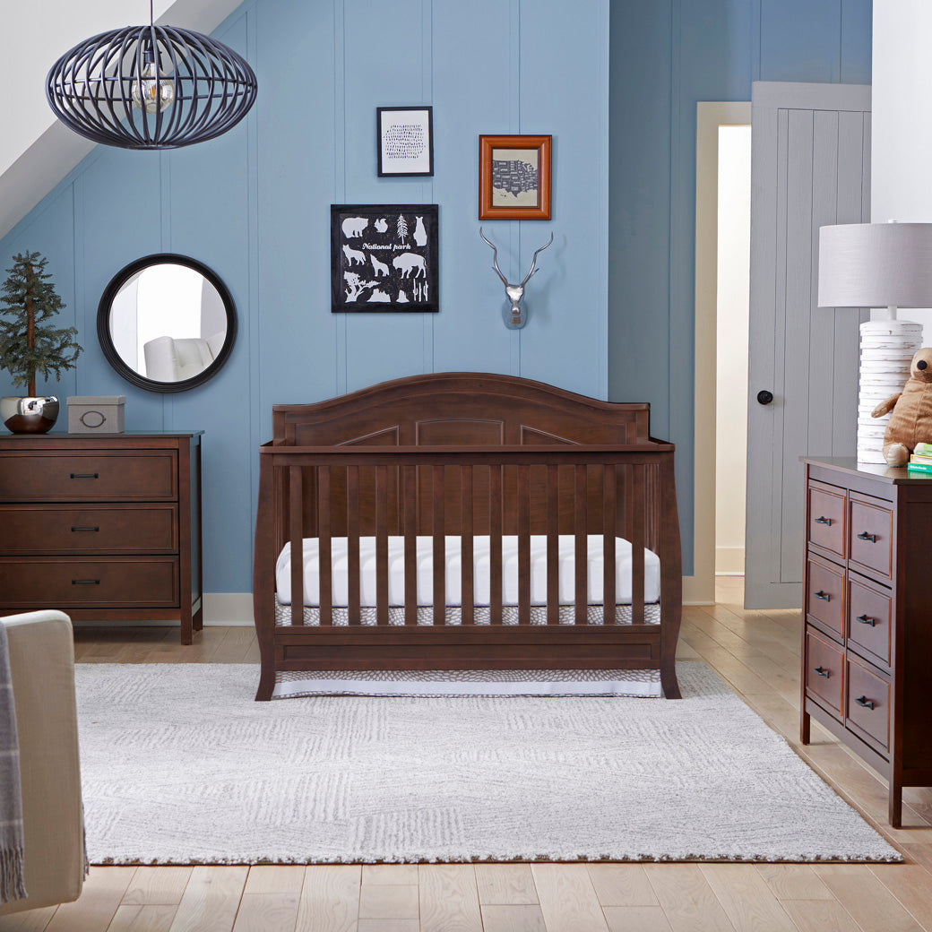 The DaVinci Charlie 6-Drawer Dresser next to a bed, lifestyle photo in -- Color_Espresso