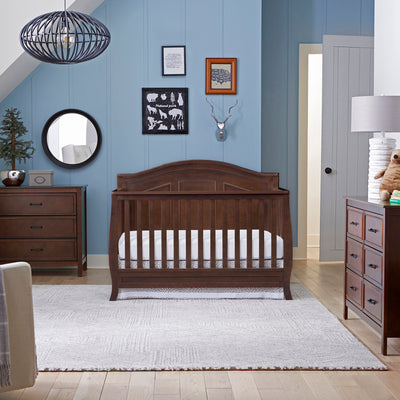 The DaVinci Charlie 6-Drawer Dresser next to a bed, lifestyle photo in -- Color_Espresso