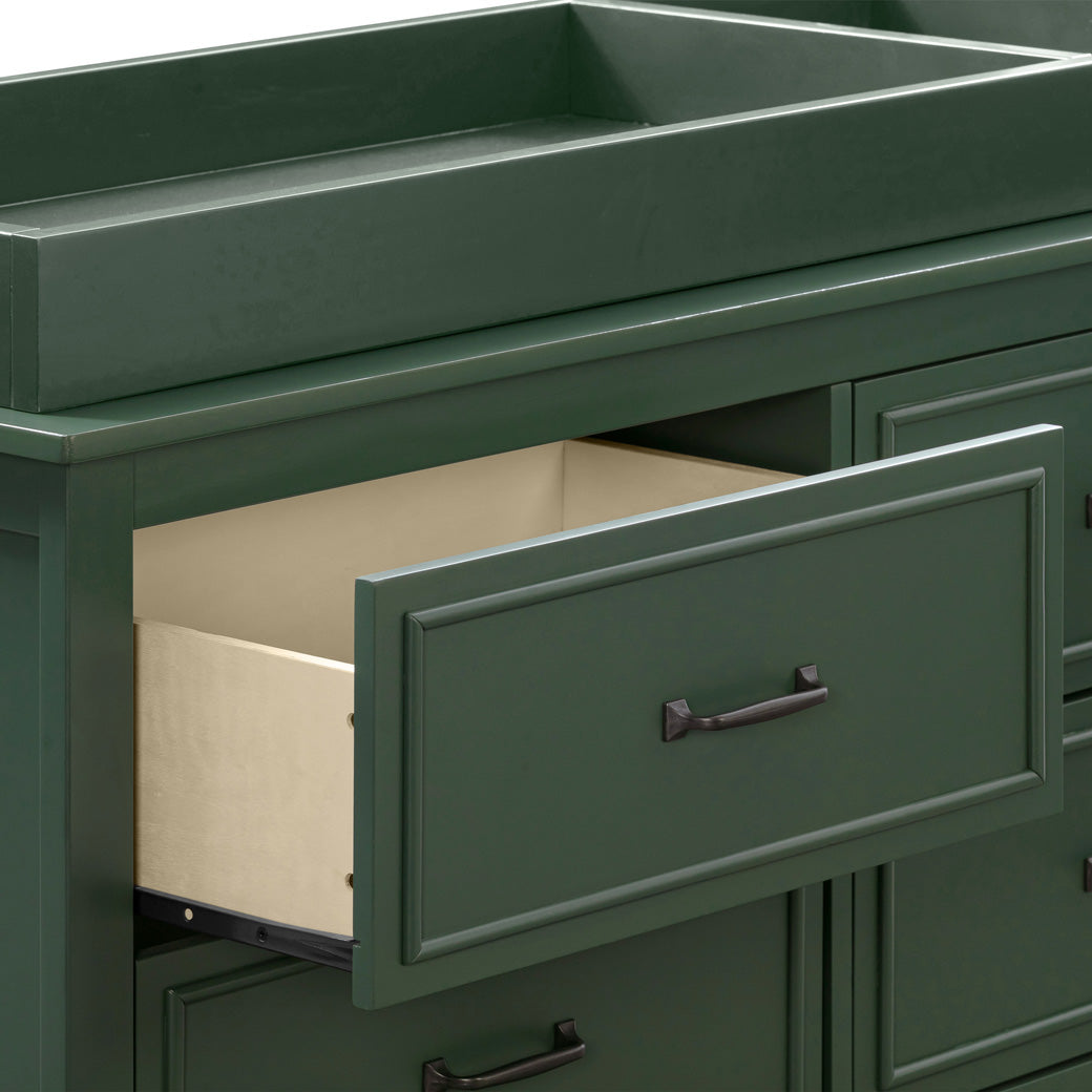 Closeup of open drawer of The DaVinci Charlie 6-Drawer Dresser with changing tray  in -- Color_Forest Green