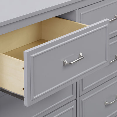 Closeup of open drawer of The DaVinci Charlie 6-Drawer Dresser in -- Color_Grey