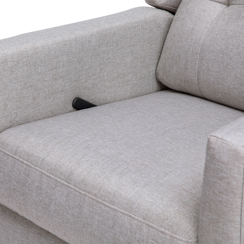 Closeup of the seat of DaVinci's Maddox Recliner & Swivel Glider in -- Color_Misty Grey