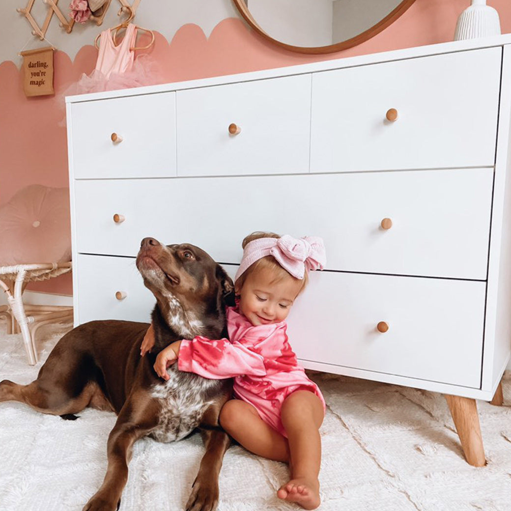 Baby and dog next to the Dadada Austin 5-Drawer Dresser in -- Color_White/Natural