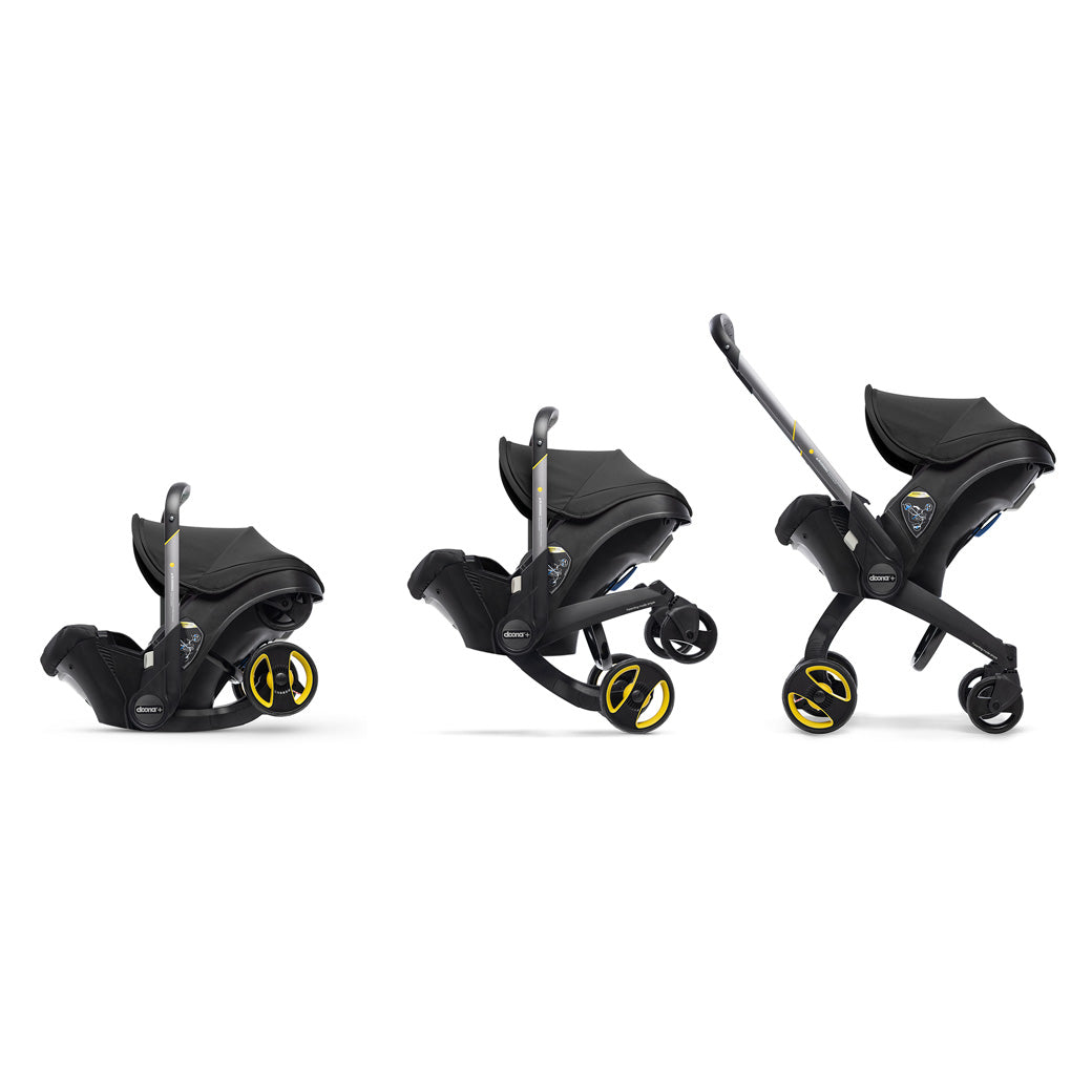 Profile view of Doona Infant Car Seat and Stroller in -- Color_Nitro Black