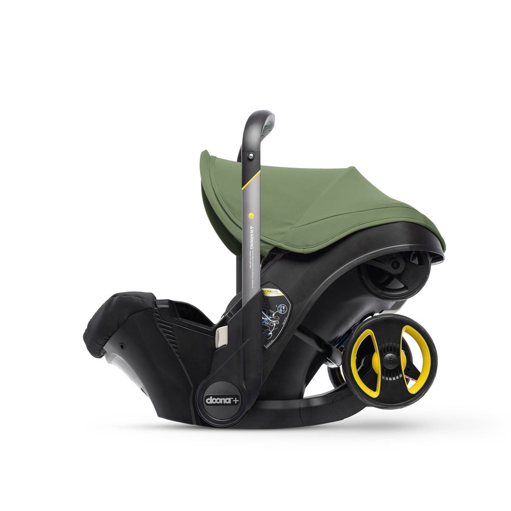 Folded up Doona Infant Car Seat and Stroller in -- Color_Desert Green