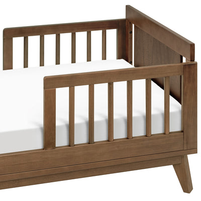 Right side view of assembled Junior Bed Conversion Kit For Hudson And Scoot Crib in -- Color_Natural Walnut