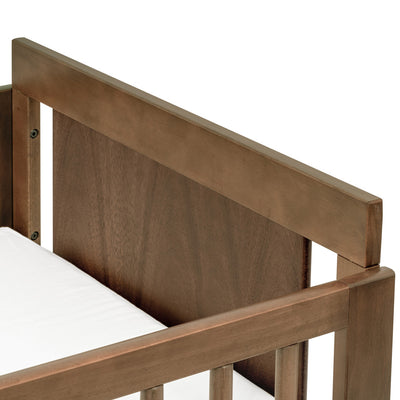 Closeup of Junior Bed Conversion Kit For Hudson And Scoot Crib in -- Color_Natural Walnut