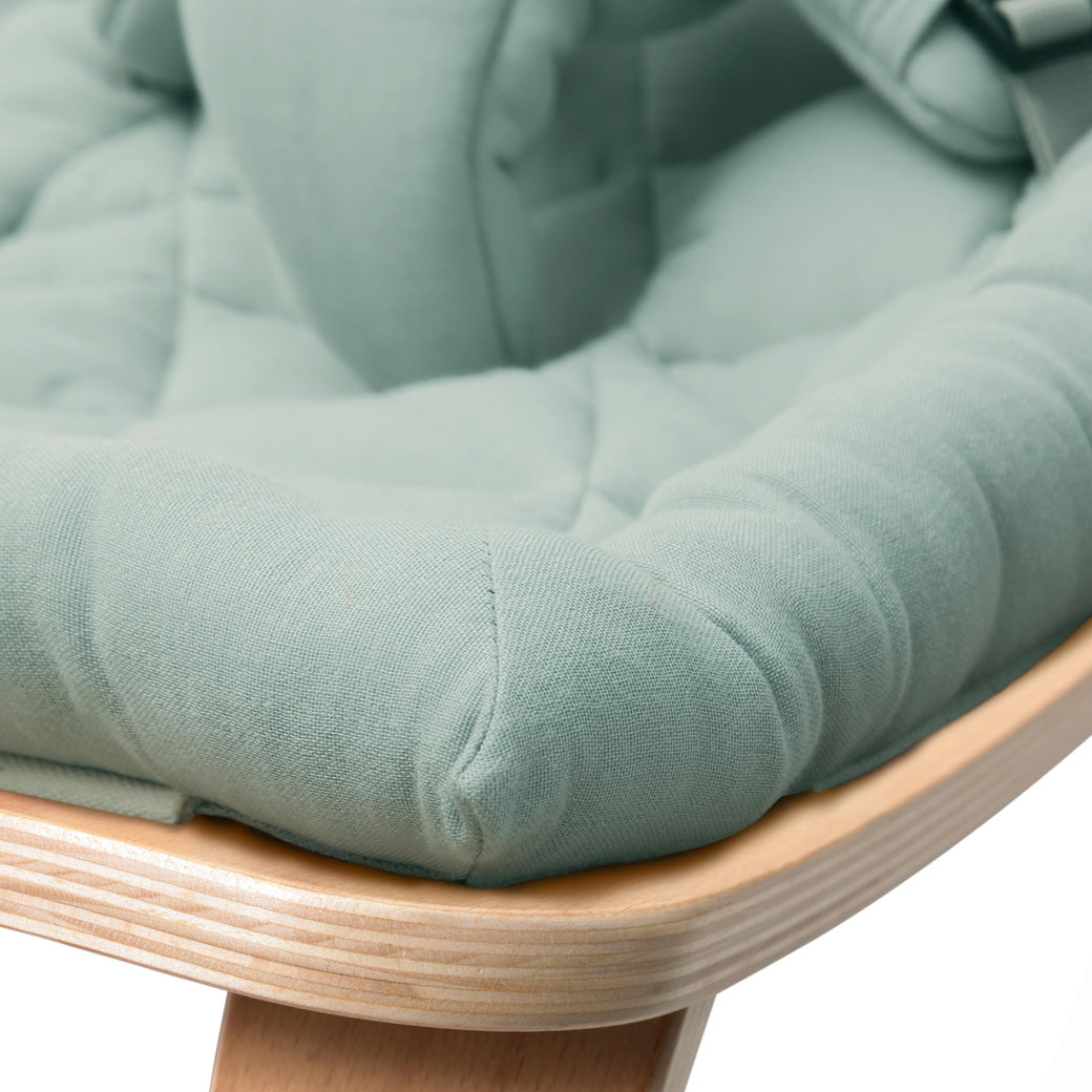 Up close of the front edge on the Charlie Crane LEVO Baby Rocker in -- Color_Farrow _ Beech