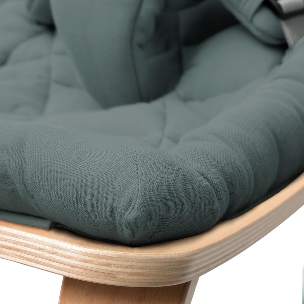 Up close of the front edge on the Charlie Crane LEVO Baby Rocker in -- Color_Orage _ Beech