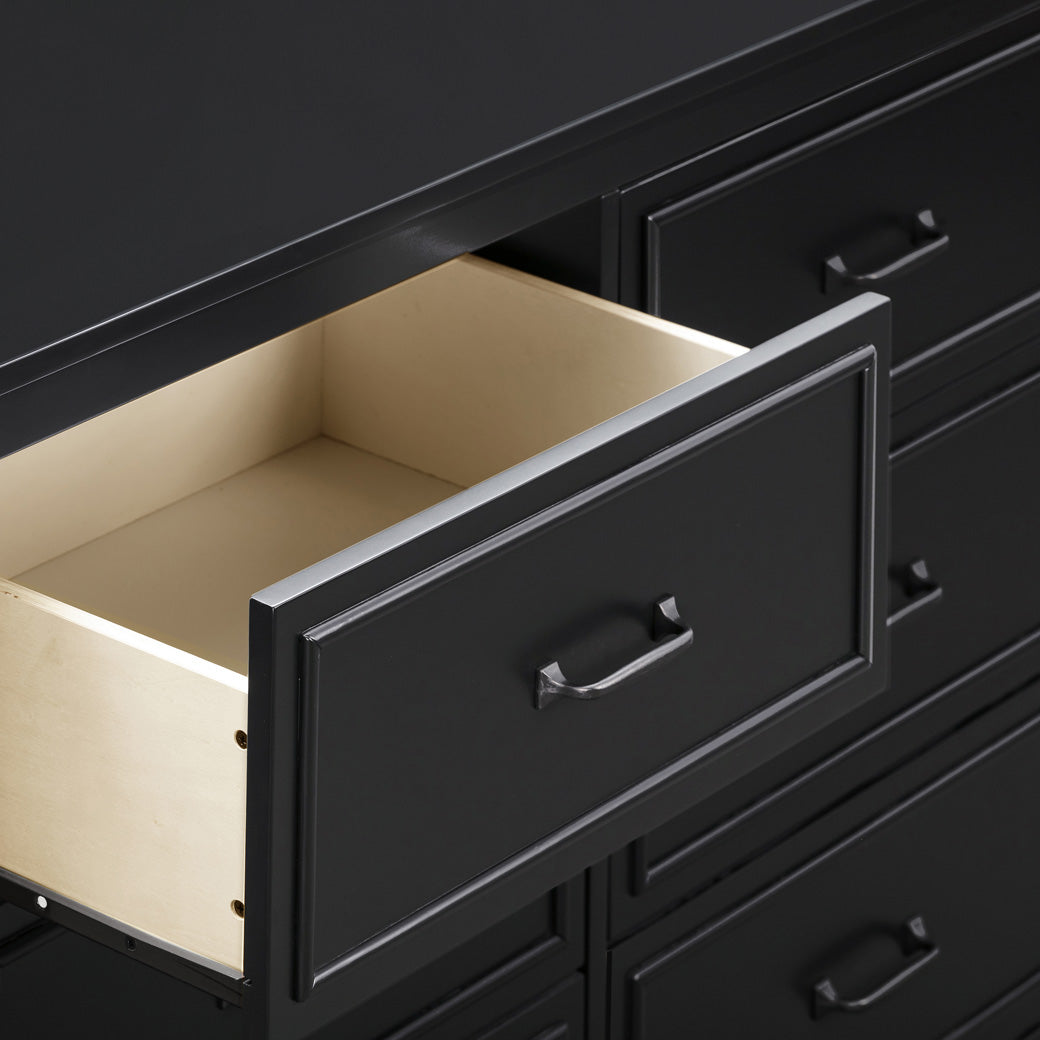 Closeup of open drawer of The DaVinci Charlie 6-Drawer Dresser in -- Color_Ebony