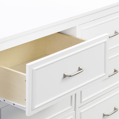 Closeup of open drawer of The DaVinci Charlie 6-Drawer Dresser in -- Color_White