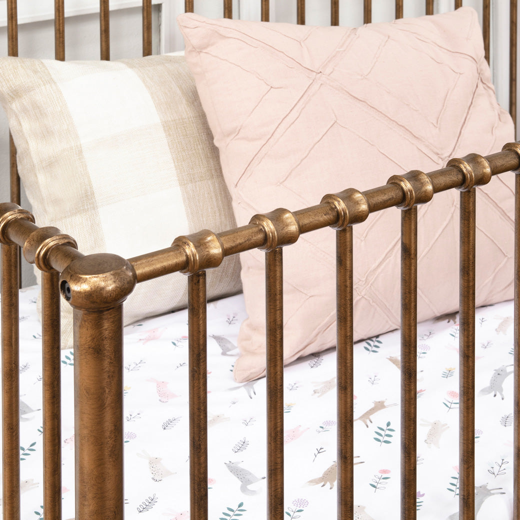 Details of rails of Namesake's Winston 4 in 1 Convertible Crib in -- Color_Vintage Gold
