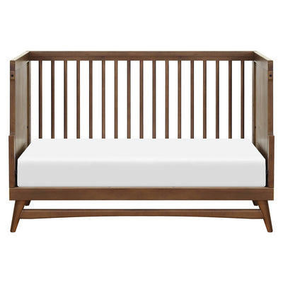 Front view of Babyletto's Peggy 3-in-1 Convertible Crib as daybed in -- Color_Natural Walnut