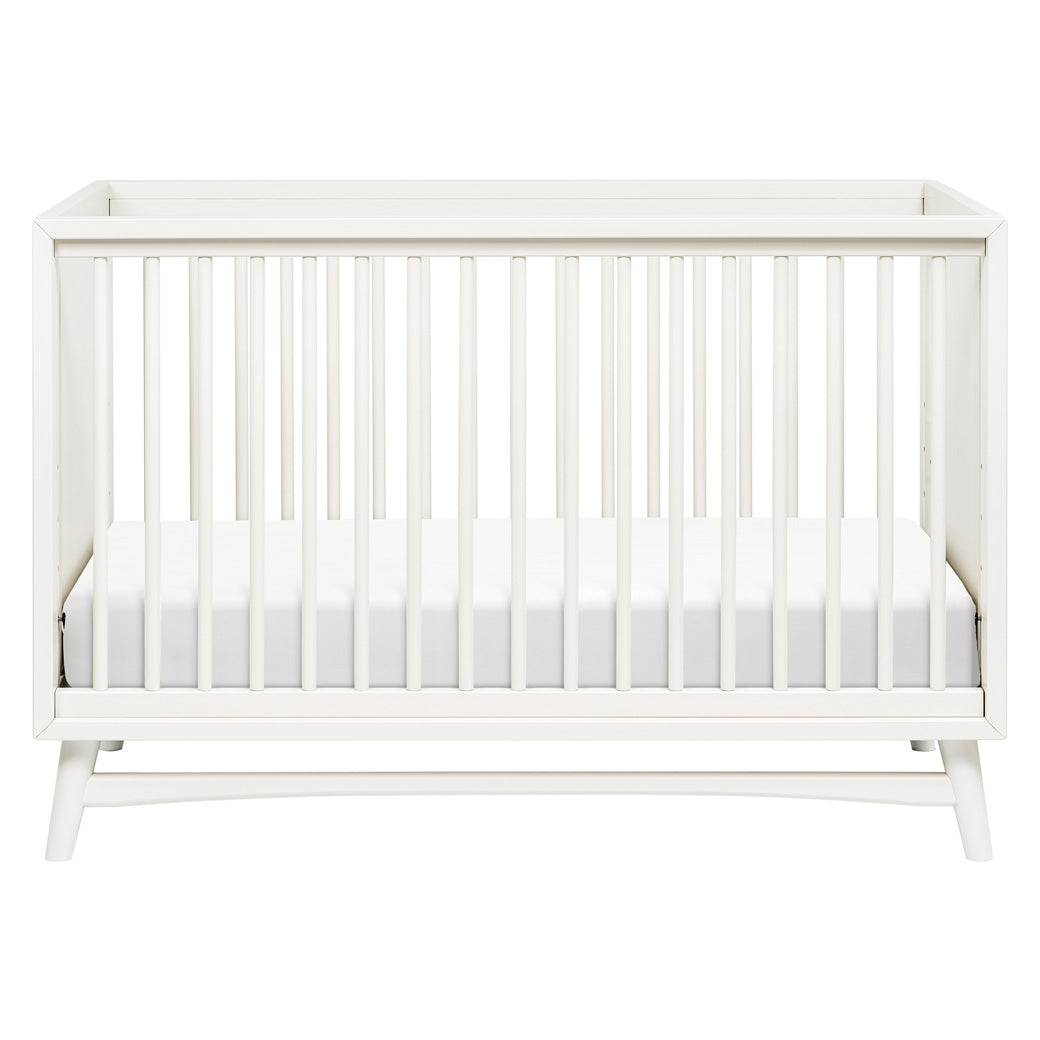 Front view of Babyletto's Peggy 3-in-1 Convertible Crib in -- Color_Warm White