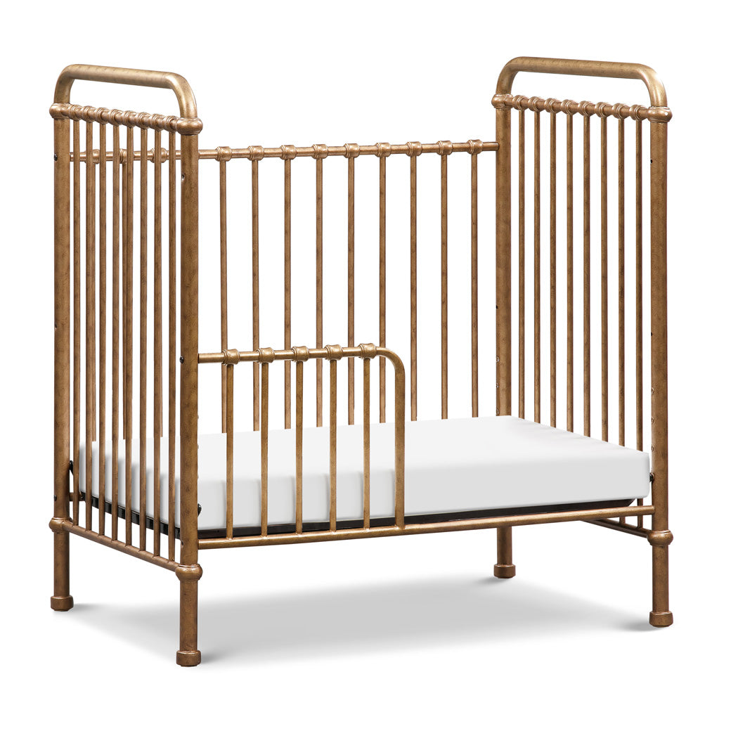 Namesake`s Abigail 3-in-1 Convertible Mini Crib as a toddler bed in -- Color_Vintage Gold