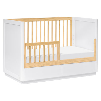The Babyletto Bento 3-in-1 Convertible Storage Crib converted into toddler bed in -- Color_White Natural