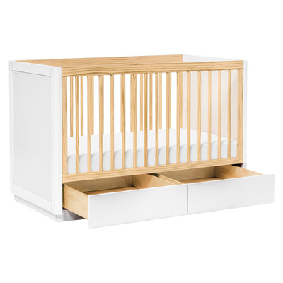 The Babyletto Bento 3-in-1 Convertible Storage Crib with Toddler Bed Conversion Kit with open drawers in -- Color_White Natural