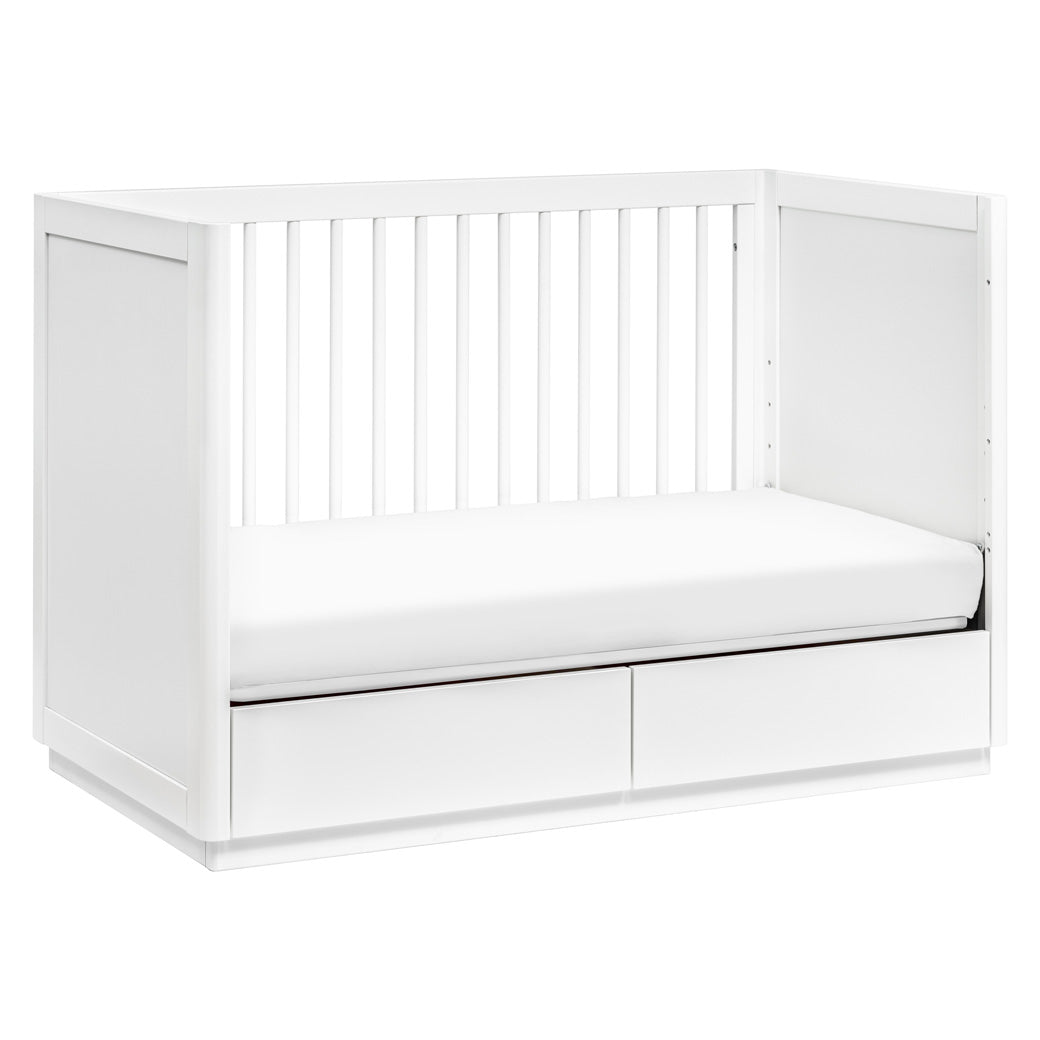 The Babyletto Bento 3-in-1 Convertible Storage Crib with Toddler Bed Conversion Kit converted into day bed in -- Color_White