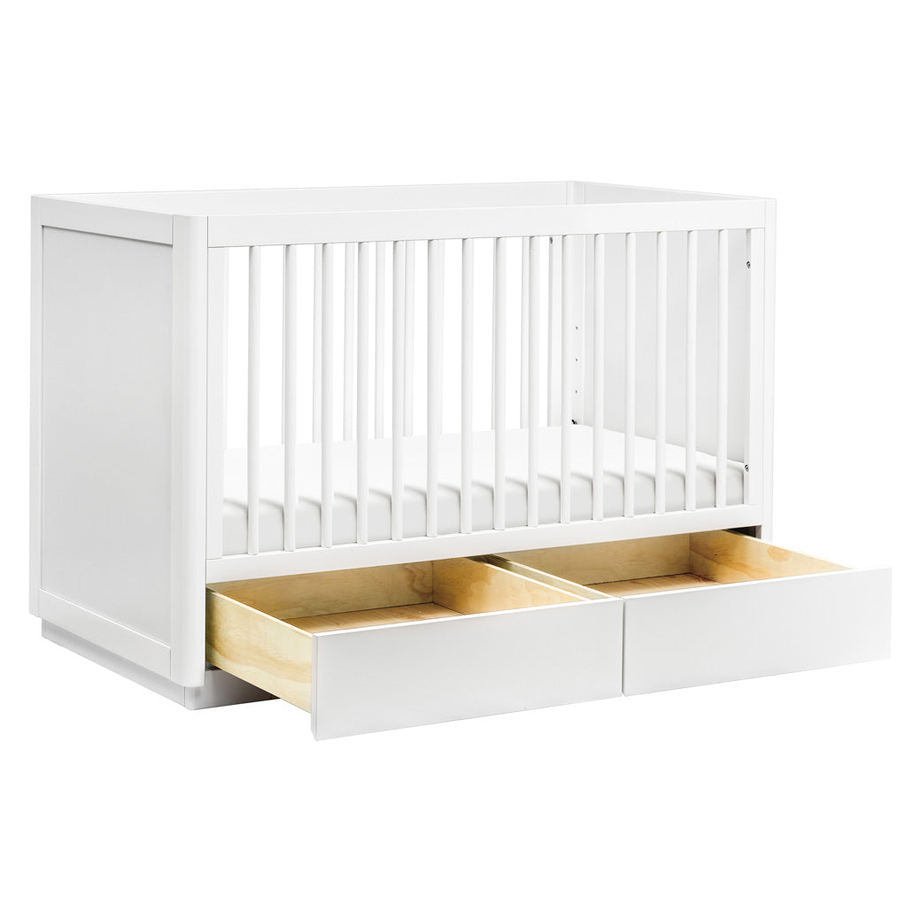 The Babyletto Bento 3-in-1 Convertible Storage Crib with Toddler Bed Conversion Kit with open drawers in -- Color_White