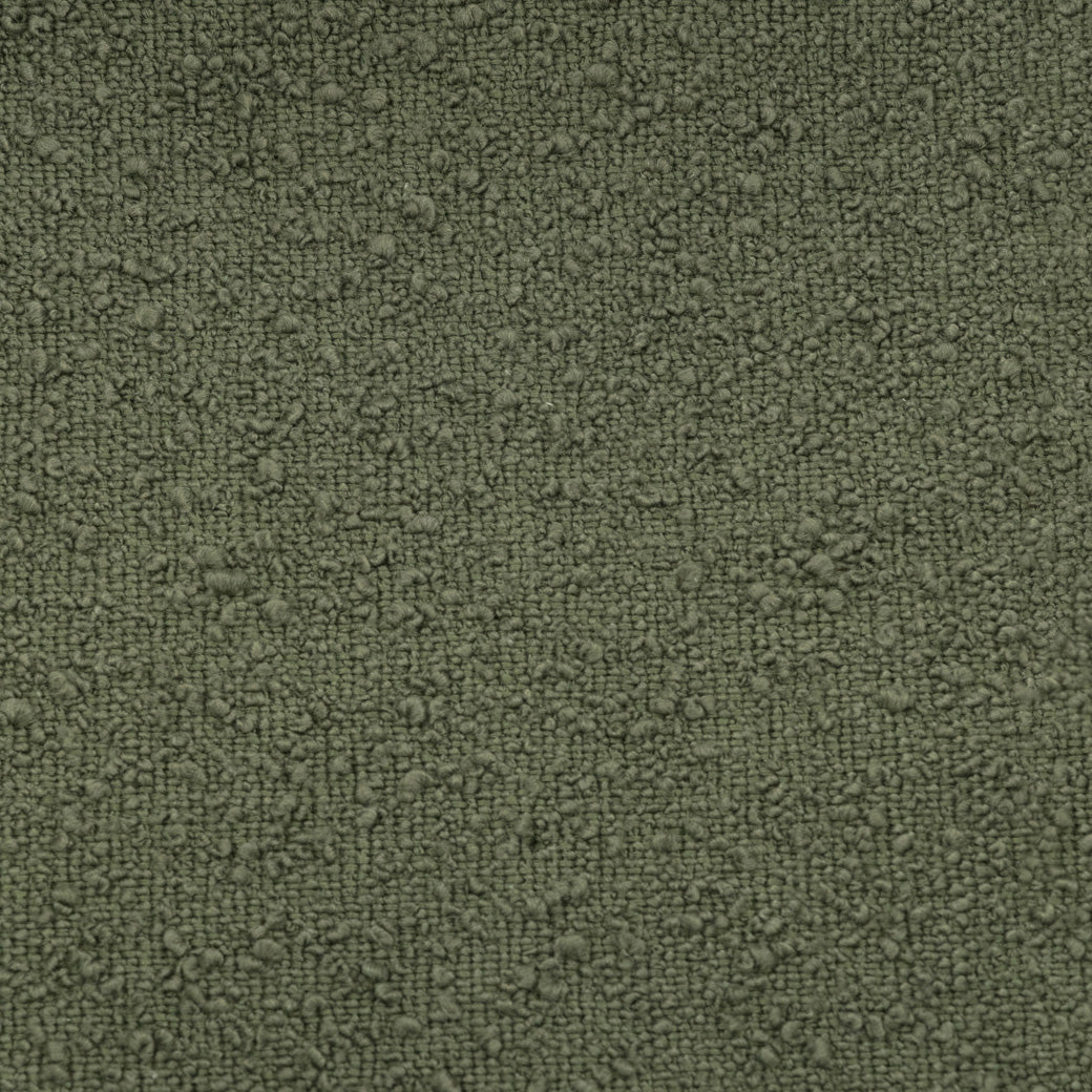 Closeup of the material of The Babyletto Enoki Storage Ottoman in --Color_Olive Boucle